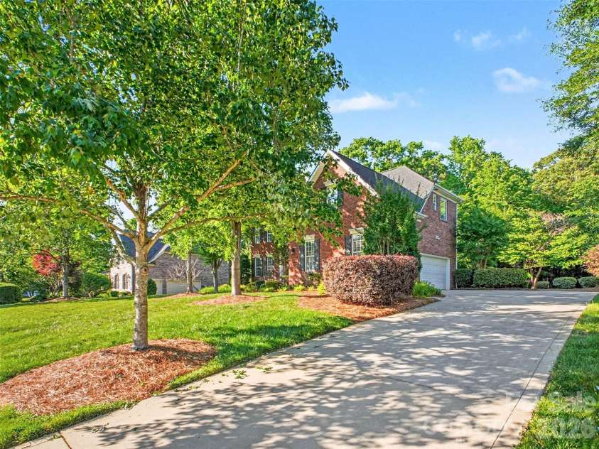 1311 Dobson Drive, Waxhaw, NC 28173.  MLS# CAR4377774, YatesRealty ID 27369. Long driveway with three car garage