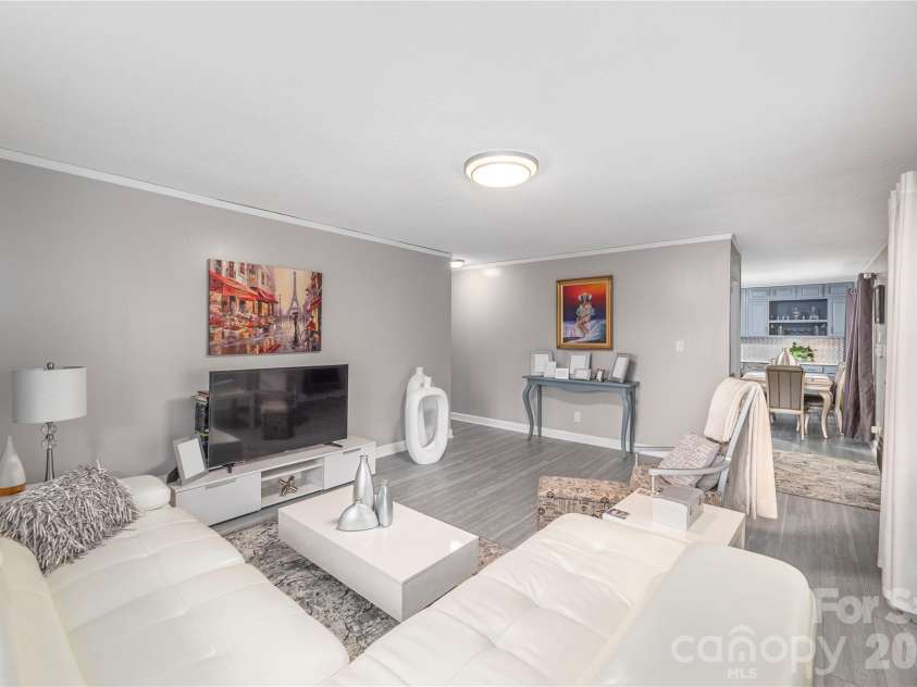 3415 Conleys Creek Road, Whittier, NC 28789.  MLS# CAR4336563, YatesRealty ID 2737. Living room looking at kitchen