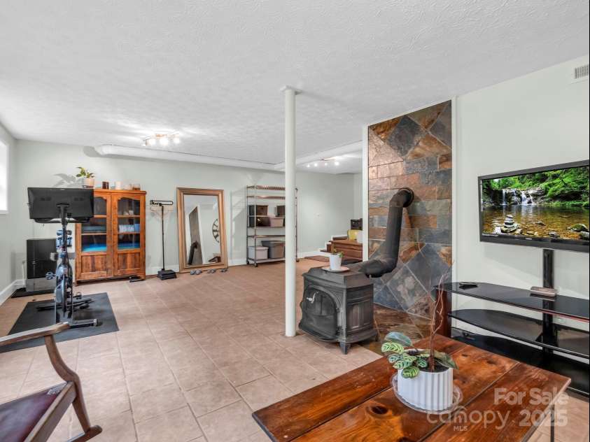 61 Overbrook Drive, Saluda, NC 28773.  MLS# CAR4281023, YatesRealty ID 27373. Basement living space with it's own exterior and also a room for laundry in basement!