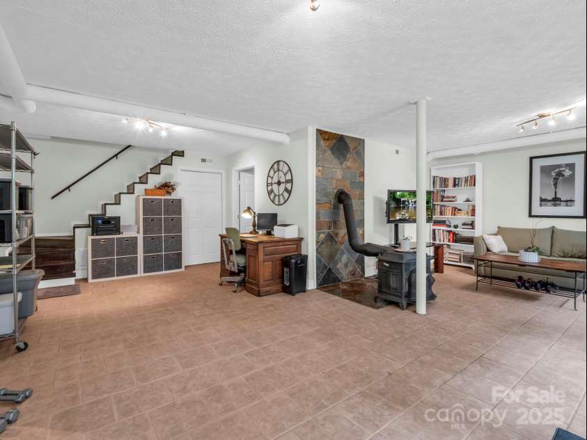 61 Overbrook Drive, Saluda, NC 28773.  MLS# CAR4281023, YatesRealty ID 27373. Basement living space with it's own exterior and also a room for laundry in basement!