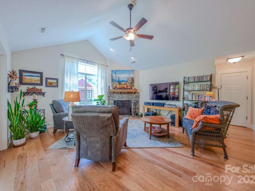 38 Westfield Way, Candler, NC 28715.  MLS# CAR4274179, YatesRealty ID 27377. Living area with cozy natural gas fireplace