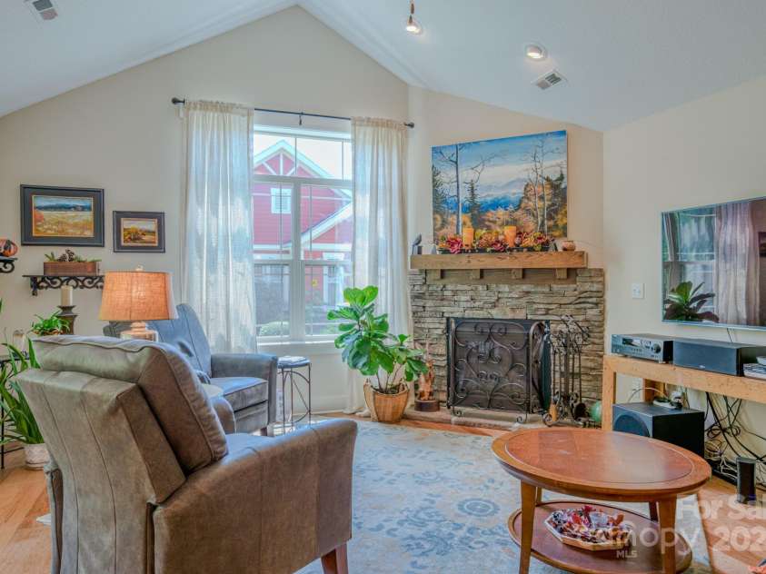 38 Westfield Way, Candler, NC 28715.  MLS# CAR4274179, YatesRealty ID 27377. Living area with cozy natural gas fireplace