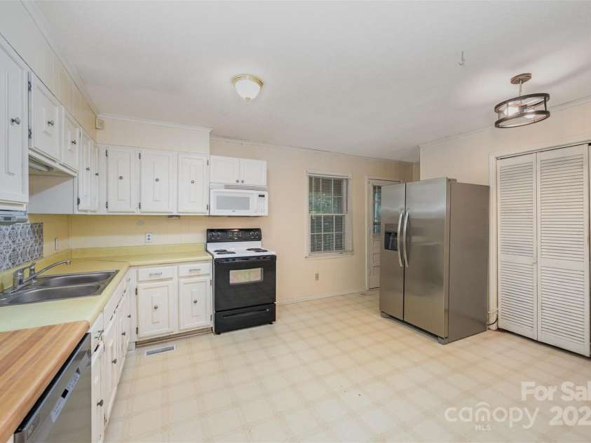 7362 Henry Harris Road, Lancaster, SC 29720.  MLS# CAR4278143, YatesRealty ID 27383. Kitchen with Newer appliances as of 2023