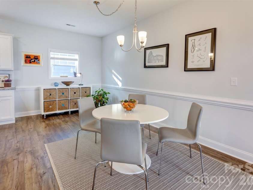 3577 County Down Avenue, Kannapolis, NC 28081.  MLS# CAR4372027, YatesRealty ID 27386. This large dining area could easily fit a larger table for 8