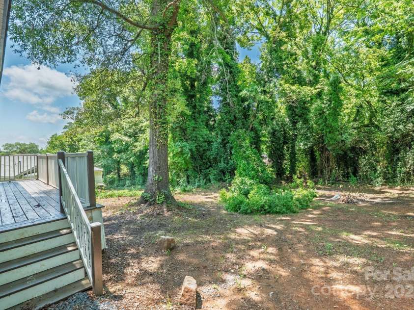 511 Lodge Street, Wadesboro, NC 28170.  MLS# CAR4276092, YatesRealty ID 27388. Backyard and deck