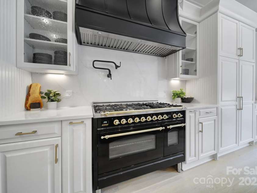 8016 Pemswood Street, Charlotte, NC 28277.  MLS# CAR4271864, YatesRealty ID 27389. ...ILVE Range, Pot Filler and Vent