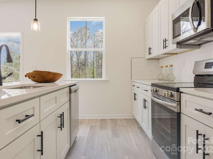 3008 Sadler Woods Lane, Charlotte, NC 28214.  MLS# CAR4210366, YatesRealty ID 2739. Stainless Steel Appliances. Representative Photo