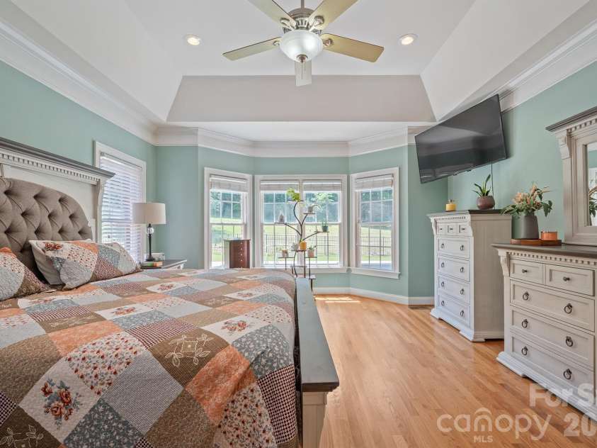137 Natures Trail, Statesville, NC 28625.  MLS# CAR4382561, YatesRealty ID 27404. Primary Suite with tray ceiling