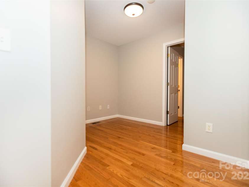 13 Castle Street, Asheville, NC 28803.  MLS# CAR4278006, YatesRealty ID 27406. Hallway to Primary Bedroom