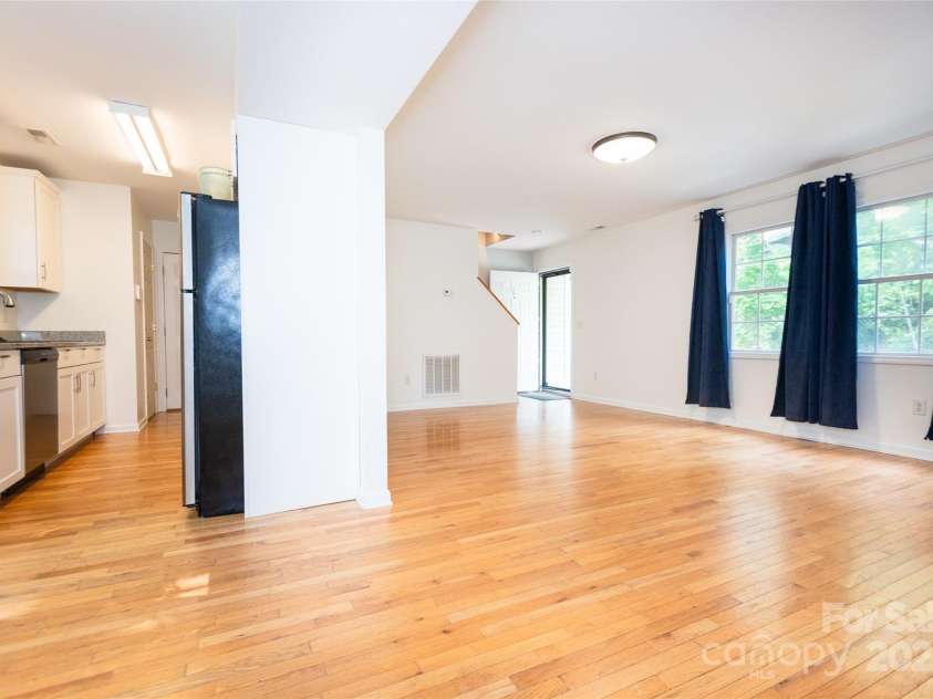 13 Castle Street, Asheville, NC 28803.  MLS# CAR4278006, YatesRealty ID 27406. View of Living Room and Kitchen from Dining Area
