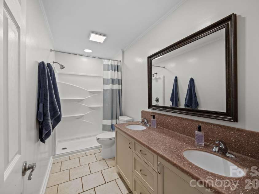 3030 Lydia Lane, Newton, NC 28658.  MLS# CAR4373237, YatesRealty ID 27409. Full Bath just off primary bedroom.