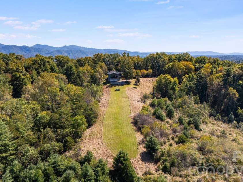 1387 Woods Ammons Road, Mars Hill, NC 28754.  MLS# CAR4303363, YatesRealty ID 2741. 20.9 acres surrounds your estate - No HOA or Restrictions! 
