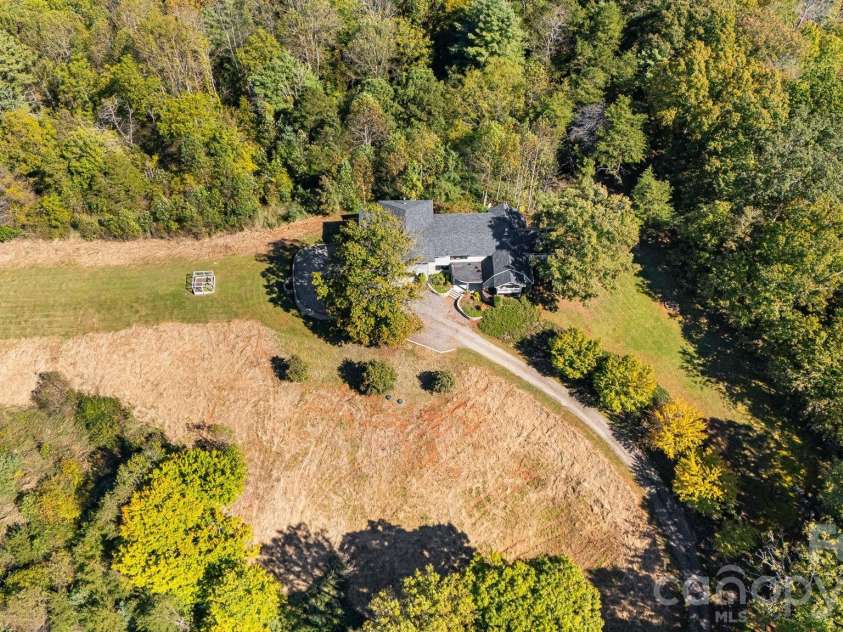 1387 Woods Ammons Road, Mars Hill, NC 28754.  MLS# CAR4303363, YatesRealty ID 2741. Aerial shot of the grounds around the home