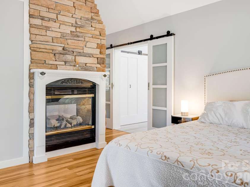 1387 Woods Ammons Road, Mars Hill, NC 28754.  MLS# CAR4303363, YatesRealty ID 2741. Dual sided fireplace in primary
