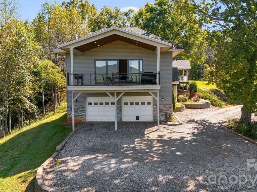 1387 Woods Ammons Road, Mars Hill, NC 28754.  MLS# CAR4303363, YatesRealty ID 2741. Garage approach with ample turn-around space and extra parking