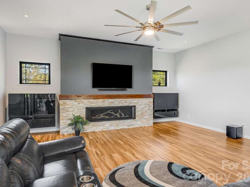 1387 Woods Ammons Road, Mars Hill, NC 28754.  MLS# CAR4303363, YatesRealty ID 2741. Gas fireplace with driftwood