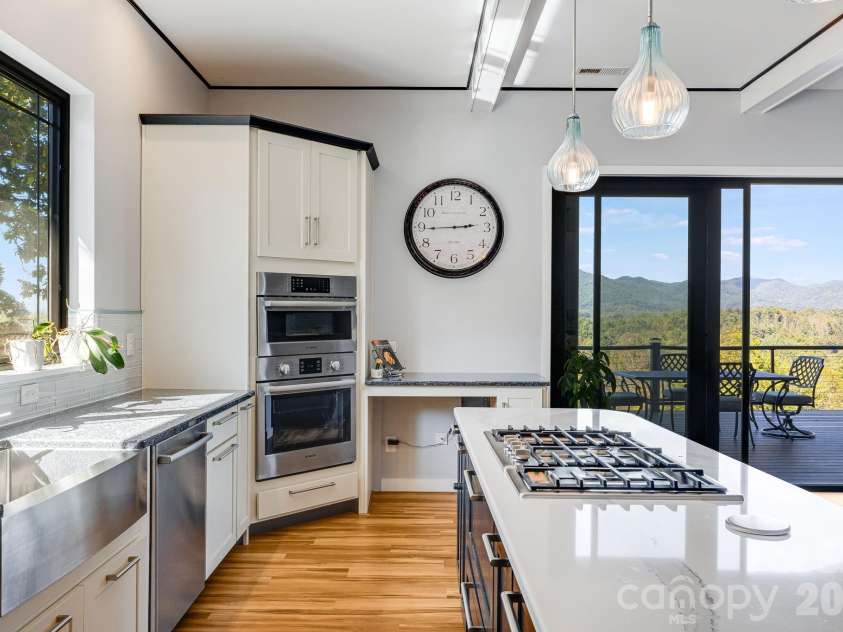 1387 Woods Ammons Road, Mars Hill, NC 28754.  MLS# CAR4303363, YatesRealty ID 2741. Kitchen with Pop-up Power tower on Island to the right of gas stove