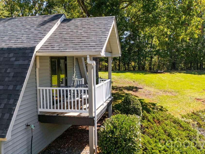 1387 Woods Ammons Road, Mars Hill, NC 28754.  MLS# CAR4303363, YatesRealty ID 2741. Romantic Sunset deck off of Primary bedroom
