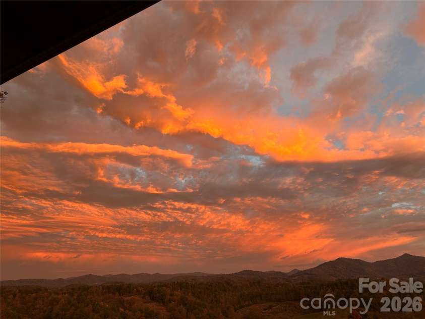 1387 Woods Ammons Road, Mars Hill, NC 28754.  MLS# CAR4303363, YatesRealty ID 2741. SUNRISE taken on 10-19-25 from the Terrace. Escape to beautiful Western NC and your own generational estate! 