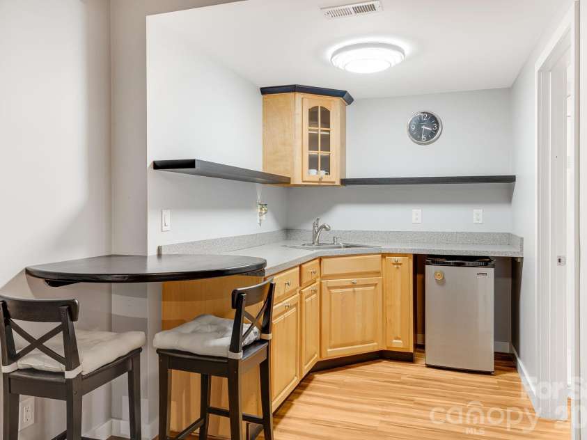 1387 Woods Ammons Road, Mars Hill, NC 28754.  MLS# CAR4303363, YatesRealty ID 2741. Theater and wet bar between two lower bedrooms