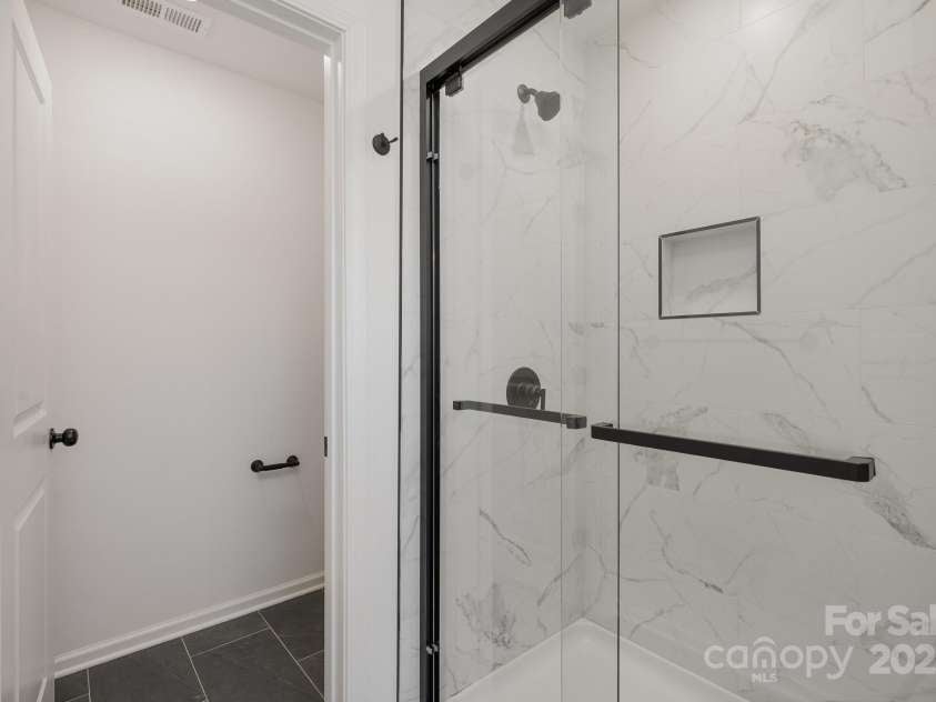 3012 Sadler Woods Lane, Charlotte, NC 28214.  MLS# CAR4211174, YatesRealty ID 2741. Framed Shower. Representative Photo