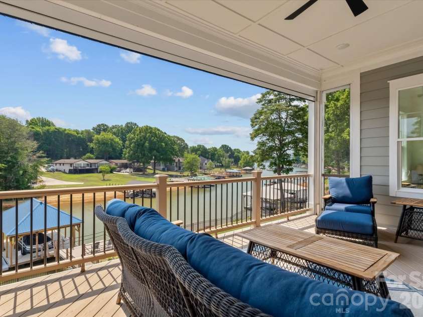 176 Hazelton Loop, Mooresville, NC 28117.  MLS# CAR4385381, YatesRealty ID 27414. Covered deck w/retractable screen