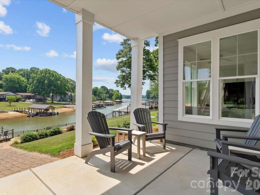 176 Hazelton Loop, Mooresville, NC 28117.  MLS# CAR4385381, YatesRealty ID 27414. Covered lakeside patio