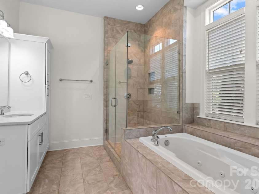 176 Hazelton Loop, Mooresville, NC 28117.  MLS# CAR4385381, YatesRealty ID 27414. Owner's Bath