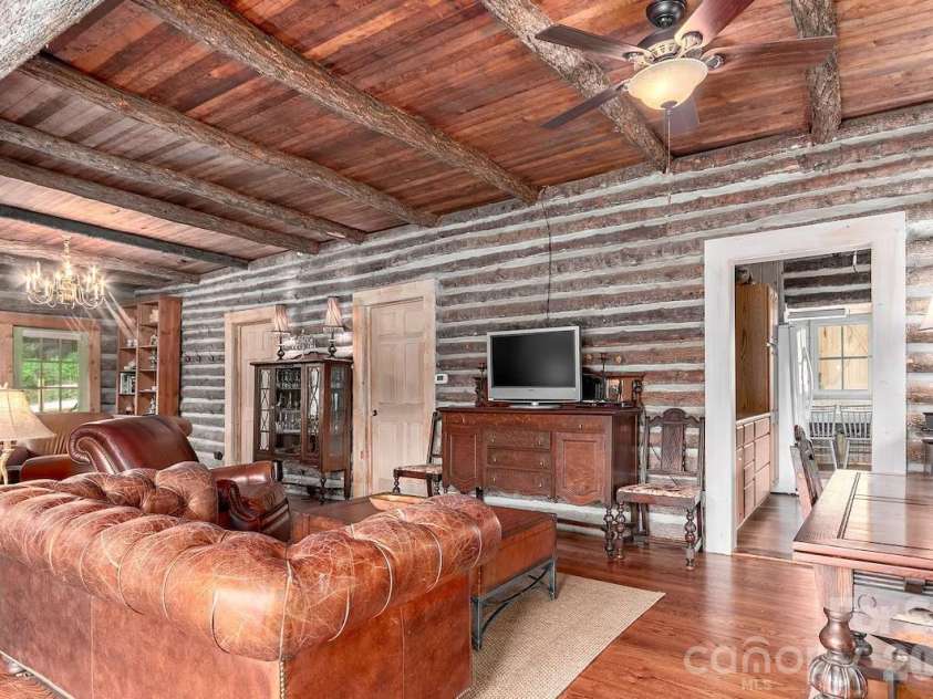 72 Chestnut Hill Road, Gerton, NC 28735.  MLS# CAR4375202, YatesRealty ID 27416. Main Cabin - living room