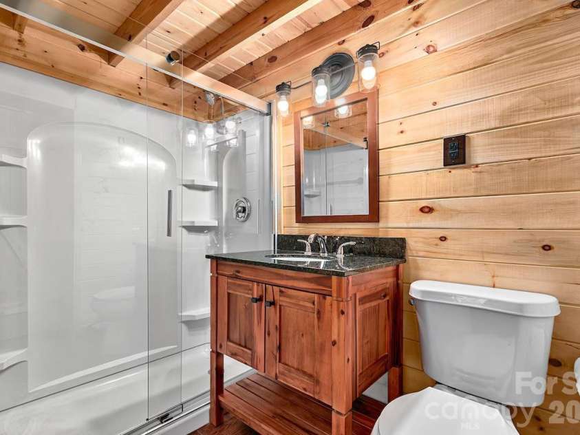 72 Chestnut Hill Road, Gerton, NC 28735.  MLS# CAR4375202, YatesRealty ID 27416. Sunflower Cottage - full bathroom