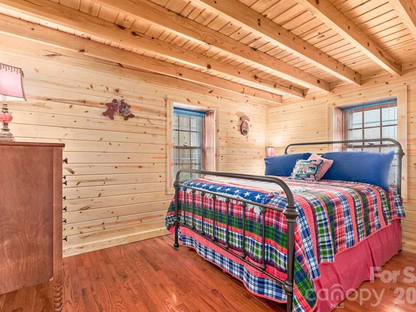 72 Chestnut Hill Road, Gerton, NC 28735.  MLS# CAR4375202, YatesRealty ID 27416. Sunflower Cottage - primary bedroom