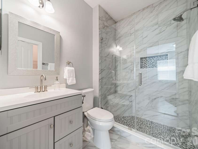 1109 Cooper Lane, Indian Trail, NC 28079.  MLS# CAR4384307, YatesRealty ID 27420. Downstairs Primary Full Bathroom