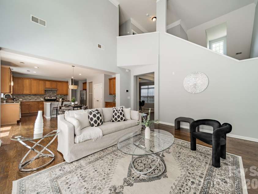 1109 Cooper Lane, Indian Trail, NC 28079.  MLS# CAR4384307, YatesRealty ID 27420. Living Room looking through to kitchen