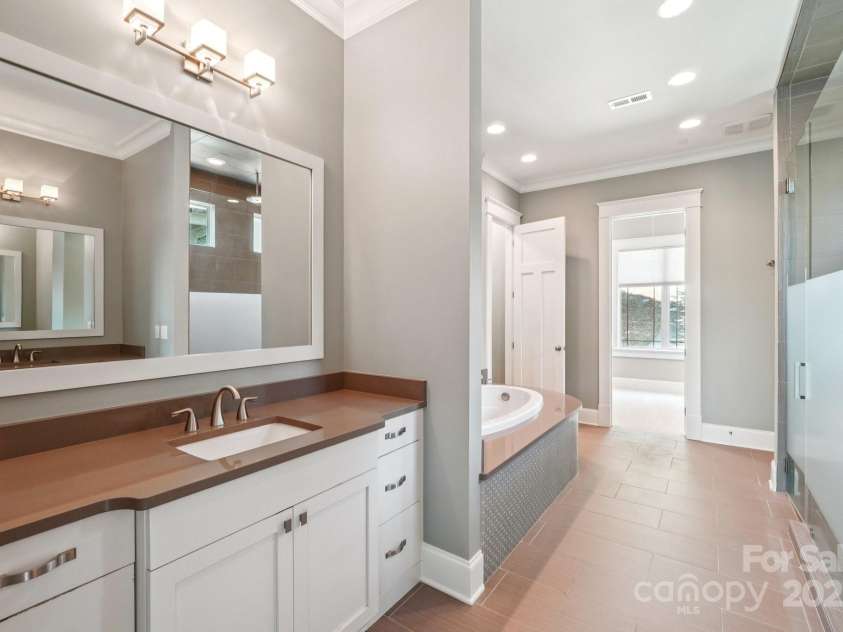 3229 Lake Pointe Drive, Belmont, NC 28012.  MLS# CAR4277223, YatesRealty ID 27427. Primary bath with split vanity
