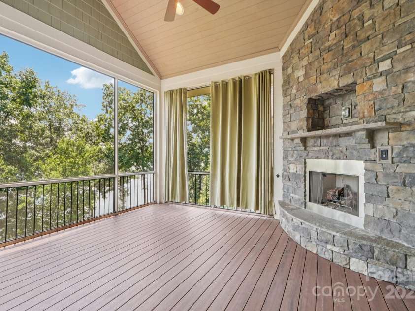 3229 Lake Pointe Drive, Belmont, NC 28012.  MLS# CAR4277223, YatesRealty ID 27427. Screened porch with outdoor fireplace