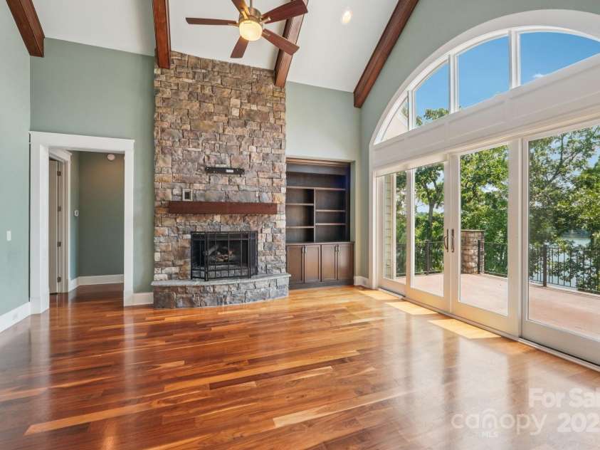 3229 Lake Pointe Drive, Belmont, NC 28012.  MLS# CAR4277223, YatesRealty ID 27427. Stacked stone fireplace and built ins
