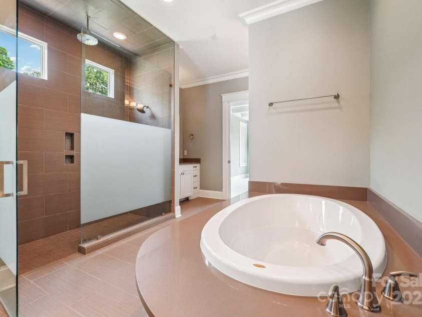 3229 Lake Pointe Drive, Belmont, NC 28012.  MLS# CAR4277223, YatesRealty ID 27427. Zero entry shower and soaking tub