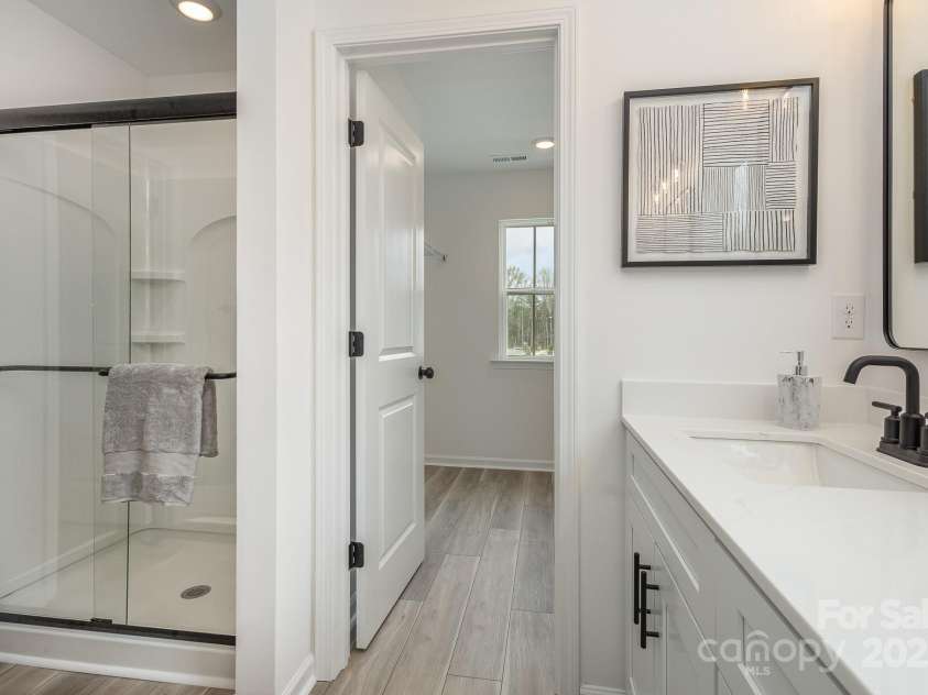 927 Cathey Road, Charlotte, NC 28214.  MLS# CAR4220441, YatesRealty ID 2743. Primary bathroom. Representative Photo