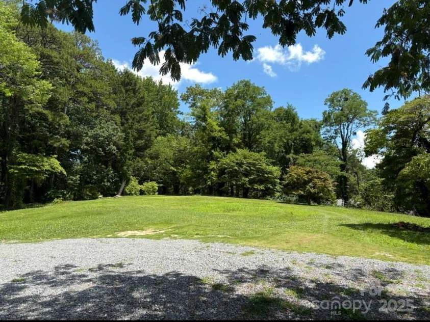 225 Wilderness Road, Tryon, NC 28782.  MLS# CAR4272632, YatesRealty ID 27434. Building site for your Tryon Dream home!