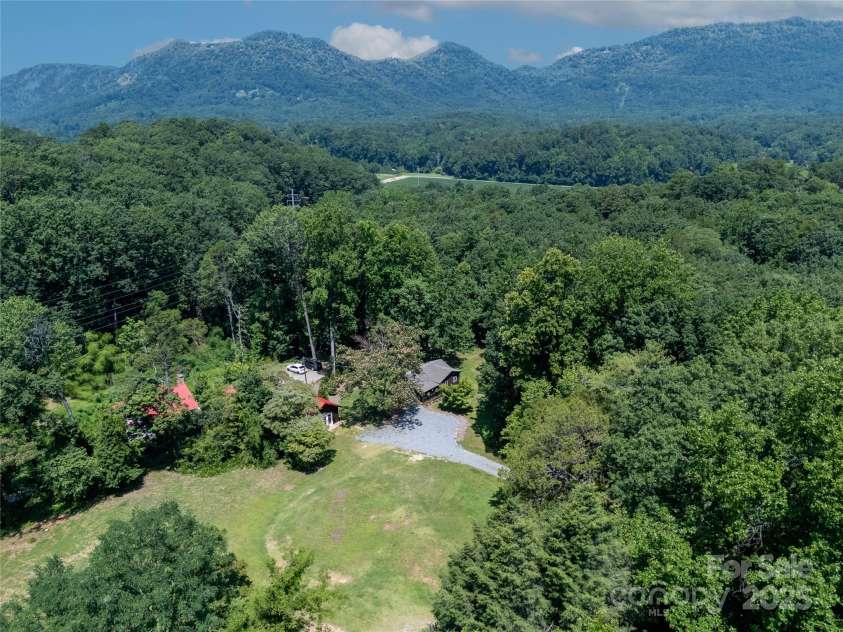 225 Wilderness Road, Tryon, NC 28782.  MLS# CAR4272632, YatesRealty ID 27434. Building site in the middle of this property!