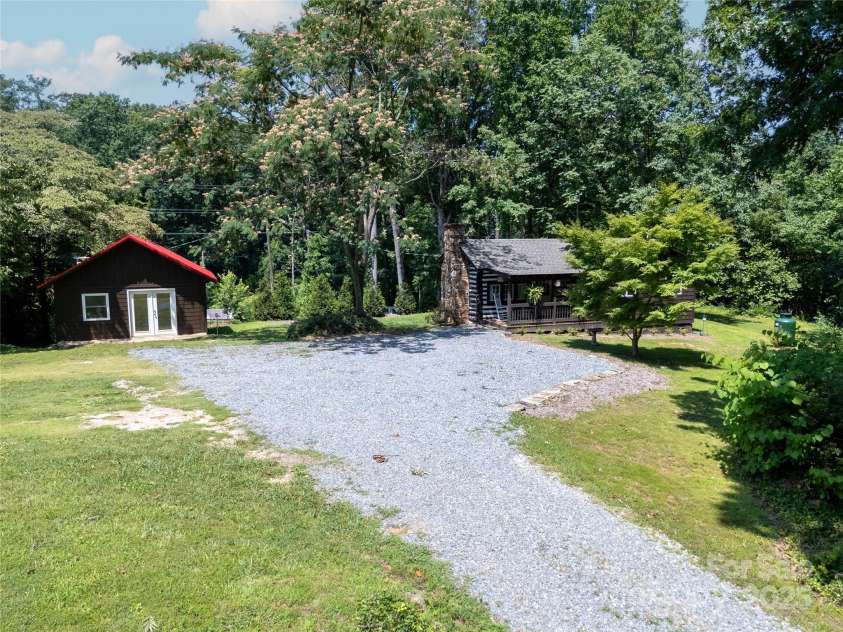 225 Wilderness Road, Tryon, NC 28782.  MLS# CAR4272632, YatesRealty ID 27434. Driveway in to Cabin & Workshop