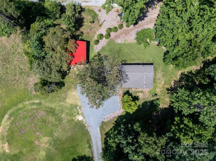 225 Wilderness Road, Tryon, NC 28782.  MLS# CAR4272632, YatesRealty ID 27434. Drone overhead view