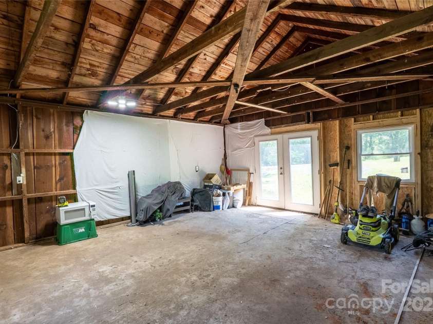 225 Wilderness Road, Tryon, NC 28782.  MLS# CAR4272632, YatesRealty ID 27434. Inside Workshop with 200 amp meter