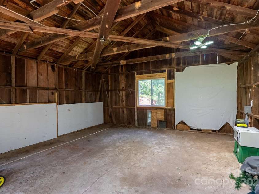 225 Wilderness Road, Tryon, NC 28782.  MLS# CAR4272632, YatesRealty ID 27434. Inside Workshop with 200 amp meter