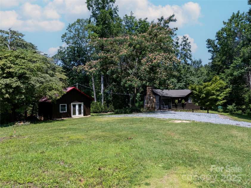 225 Wilderness Road, Tryon, NC 28782.  MLS# CAR4272632, YatesRealty ID 27434. Totally renovated Cabin with Workshop & Space to build too!
