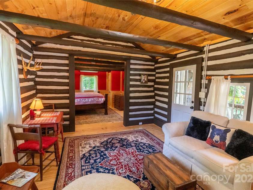 225 Wilderness Road, Tryon, NC 28782.  MLS# CAR4272632, YatesRealty ID 27434. View from Living Room to Bedroom.