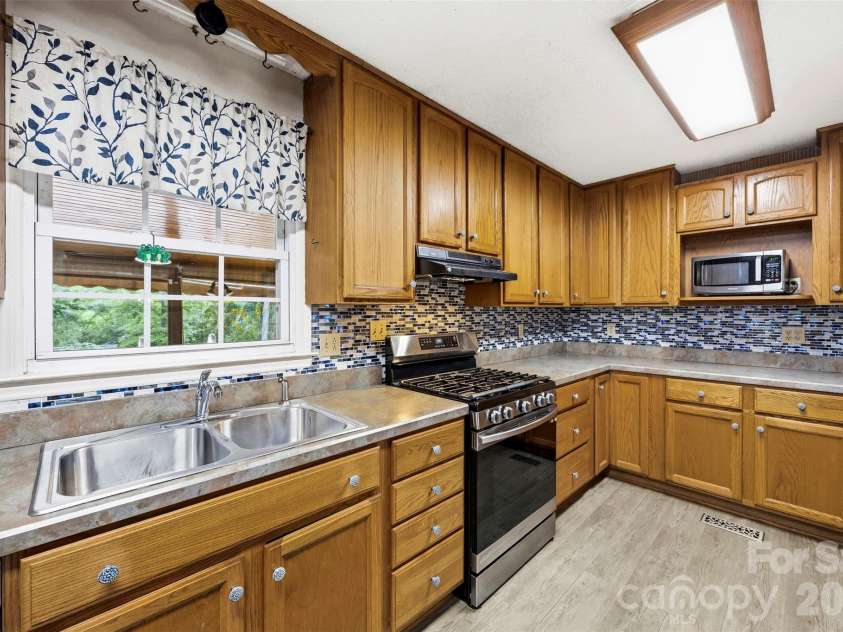 102 Stacybrook Drive, Concord, NC 28025.  MLS# CAR4387107, YatesRealty ID 27440. Kitchen (main level)