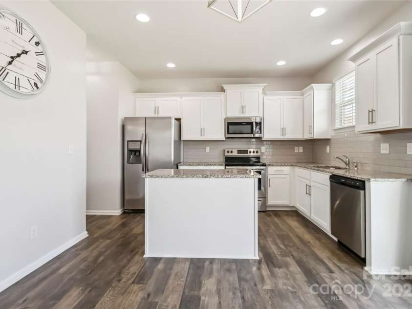 2423 Tallet Trace, Charlotte, NC 28216.  MLS# CAR4271851, YatesRealty ID 27441. Kithcen opens to living room for easy entertaining