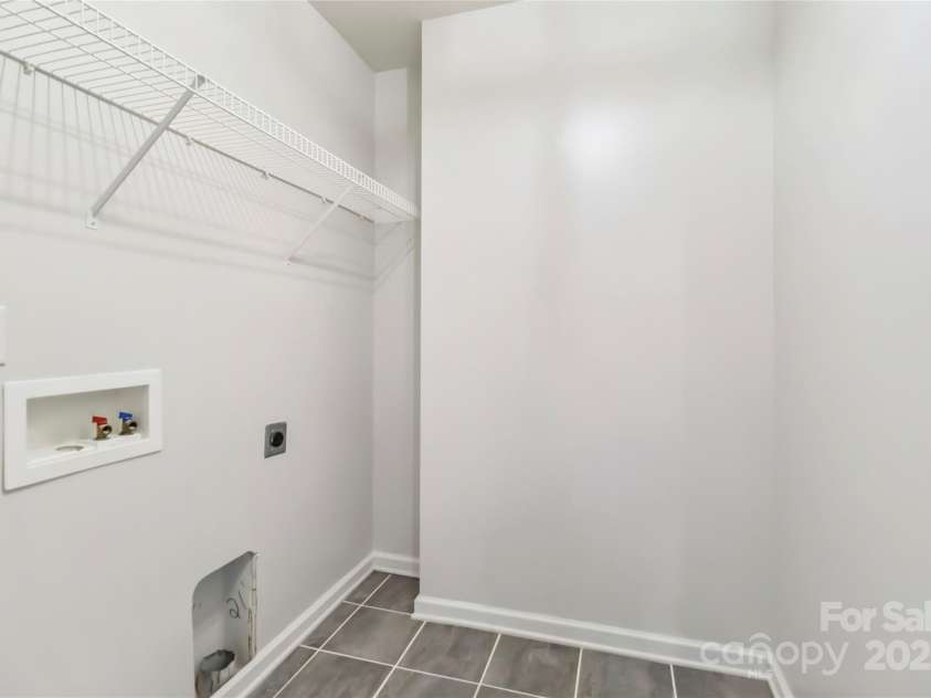 2423 Tallet Trace, Charlotte, NC 28216.  MLS# CAR4271851, YatesRealty ID 27441. Laundry on upper level