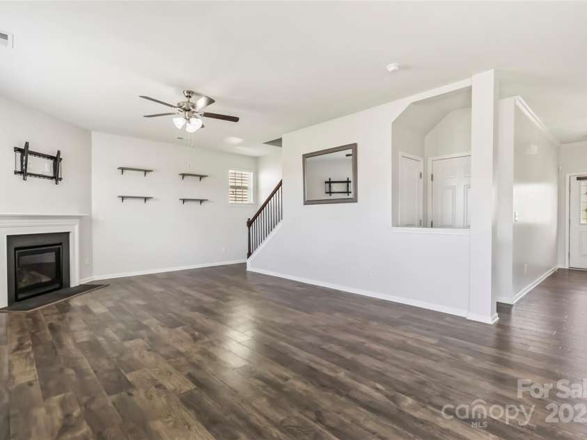 2423 Tallet Trace, Charlotte, NC 28216.  MLS# CAR4271851, YatesRealty ID 27441. Open living room with fireplace